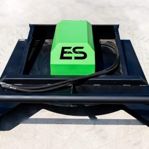 The ES 60" Standard Brush Cutter (up to 60HP) with a green cover labeled ES, black frame, and hydraulic hose is placed on a concrete surface.
